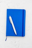 The pen lies in the notebook, the concept of study, time management. photo
