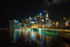 Singapore's Marina Bay nighttime skyline featuring the Marina Bay sands. photo