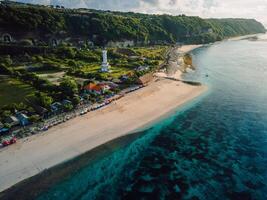 Most famous Pandawa beach with scenic landscape, lighthouse and ocean in Bali. photo