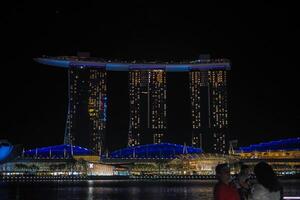 Singapore's Marina Bay nighttime skyline featuring the Marina Bay sands. photo