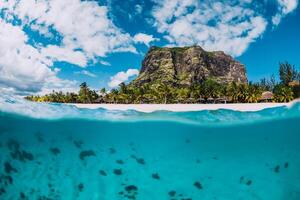 Tropical transparent ocean with Le Morne mountain and luxury beach in Mauritius. Split view. photo