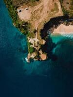 Aerial view of beach with scenic rock and ocean. Top view photo