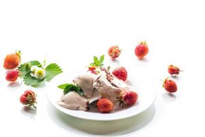 fresh organic cottage cheese with strawberries and ice cream in a plate photo