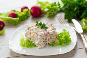 vegetable salad with boiled vegetables and dressed with mayonnaise photo