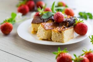 prepared cottage cheese casserole with fresh strawberries photo