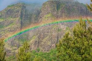 Colorful rainbow with rain and Le Morn brabant mountain photo