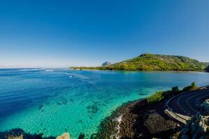 View to Le Morne from Maconde point with ocean and sunlight in Mauritius photo