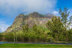 Rainbow and Le Morn brabant mountain in Mauritius island photo