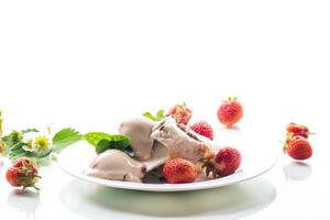 fresh organic cottage cheese with strawberries and ice cream in a plate photo