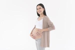 Beautiful pregnant woman applying moisturizing, stretch mark cream on belly, fertility infertility treatment, IVF, future maternity concept photo