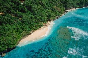 Beautiful beach with tropical ocean in Bali. Aerial view of Green bowl beach photo