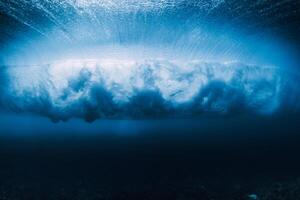 Storm wave underwater. Blue ocean in underwater. Surfing barrel wave photo