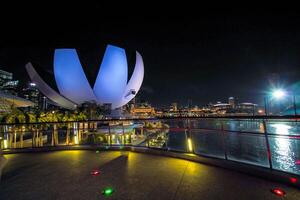 Singapore's Marina Bay nighttime skyline featuring the Marina Bay sands. photo