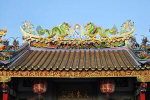 Bangkok, Thailand December 22, 2023 Beautiful roof of Lao Pun Tao Kong Shrine at Song Wat Road. It is a new famous landmark and check in point in Bangkok, Thailand. photo