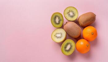 Kiwi pattern on pastel background, top view. Flat lay with fresh green kiwi slices. Minimal summer concept photo