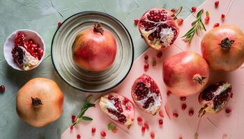 Pomegranate pattern on pastel background, top view. Flat lay with fresh pomegranate. Minimal summer concept photo