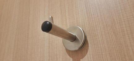 Door stopper wall. Stainless magnetic door in toilet photo