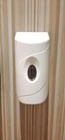 Automatic soap dispenser or hand sanitizer machine to clean bacteria and hygiene hands in toilet photo