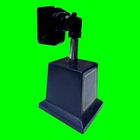 Smartphone holder, tool for photography, made of plastic and stainless with a green background texture photo