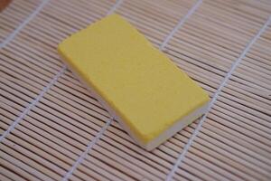 yellow snacks on a bamboo mat, close-up, selective focus photo