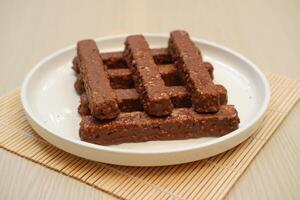 Chocolate wafers on a white plate, close-up photo