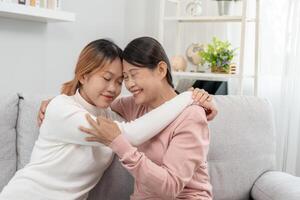 Mother day, cute asian teen girl hugging mature middle age mum. Love, kiss, care, happy smile enjoy family time. celebrate special occasion, happy birthday, merry Christmas. special day photo