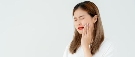 Asian woman feel toothache from gingivitis, female suffer tooth, decay problems, dental care. sensitive tooth, decay problem, bad breath, Gingival Recession, Oral Hygiene instruction, tooth extraction photo