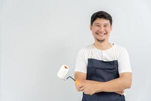 painter man, brush in hand for products to restore and paint the wall, indoor the building site of a house, wall during painting, renovation, painting, contractor, Architect, construction worker photo