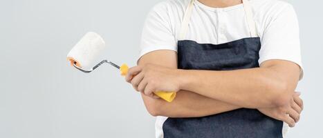 painter man, brush in hand for products to restore and paint the wall, indoor the building site of a house, wall during painting, renovation, painting, contractor, Architect, construction worker photo