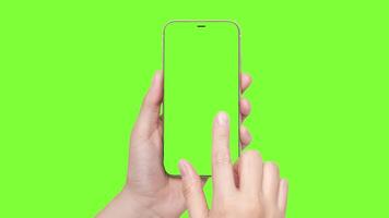 A womans hand holds a phone chromakey Mockup and the second hand with a finger scrolls. Isolated on chromakey background video