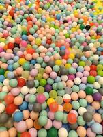 a close up of a colorful plastic ball with a colorful top. Children's playground photo