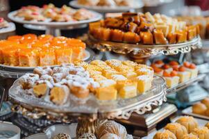 traditional desserts being served at a festive celebration or special occasion photo