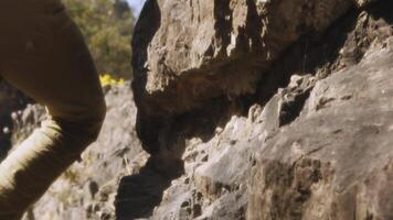 Intrepid Climbers Ascent on Rugged Terrain. A Cinematic Slow Motion Capture in Wide Angle video