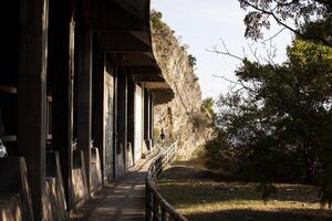 A gallery transitioning into a tunnel. Passage in the mountain above the Adriatic Sea. Sunny day. For the banner. Horizontal. photo