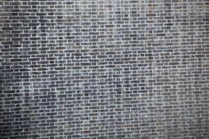 Stone texture in Lithuania. An ancient wall of stones in grey colour. Palace. Background. Template. For design. Horizontal. photo