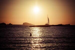 Sunset at the beach cala conta,Ibiza,Spain photo