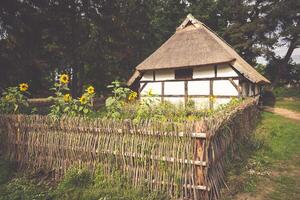 Traditional thatched house Kluki Poland photo