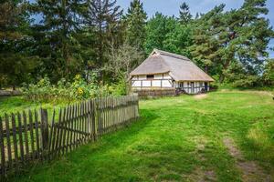 Traditional thatched house Kluki Poland photo