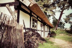 Traditional thatched house Kluki Poland photo