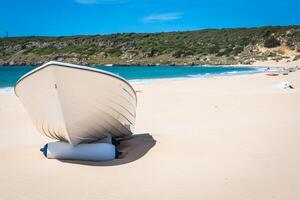 boat at bolonia beach a coastal village in the municipality of Tarifa in the Province of Cadiz in southern Spain. photo