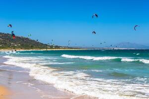 kites flying over Tarifa beach photo