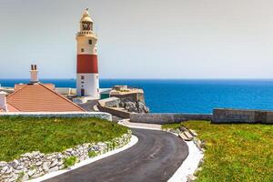 a view of the Trinity Lighthouse at Europa Point, in Gibraltar, and the Mediterranean sea photo