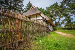 Traditional thatched house Kluki Poland photo