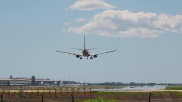 Large jetliner flying through blue cloudy sky video