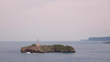 Lighthouse on island in ocean video