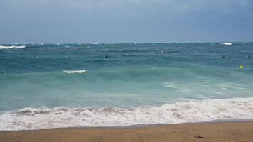 Group of surfers riding surfboards on wave video