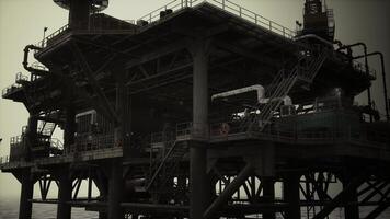 An oil rig in the middle of the ocean photo