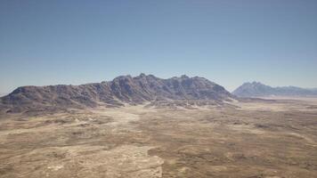 An aerial view of a mountain range in the desert photo