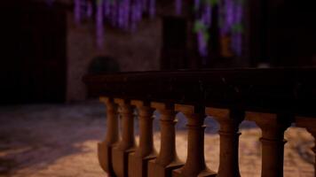 A close up of a railing with a brick building in the background photo