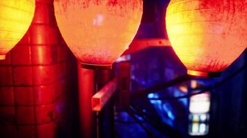 A couple of red and yellow lanterns sitting next to each other photo